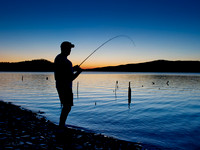Bank fishing in the twilight
